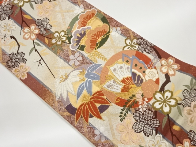 丸文に松竹梅・蝶・桜模様織出し全通袋帯